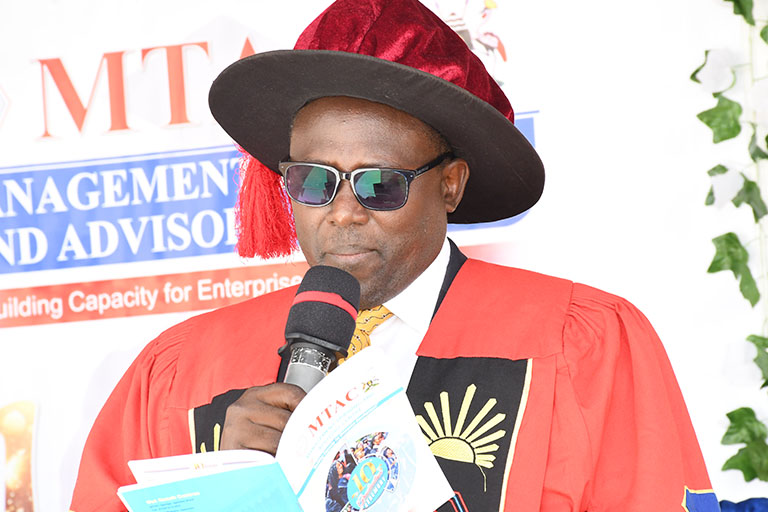Photo of Dr. Joshua Mutambi presides over the 1st episode of the 10th graduation ceremony at Ntungamo Campus.